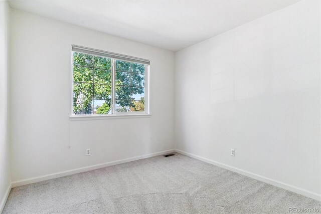 empty room with carpet flooring