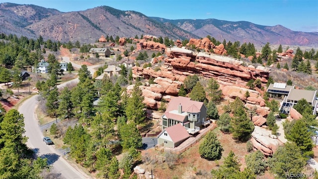 birds eye view of property with a mountain view