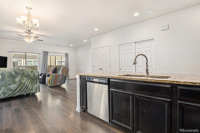 14700 E 104th Ave Unit 1105, Commerce City, CO 80022 - kitchen featuring stainless steel dishwasher, a sink, dark cabinets, ceiling fan, and dark wood finished floors