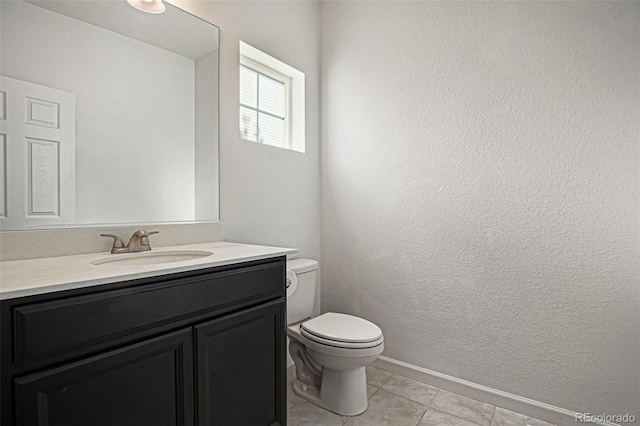 14700 E 104th Ave Unit 1105, Commerce City, CO 80022 - bathroom featuring toilet, vanity, and tile patterned flooring