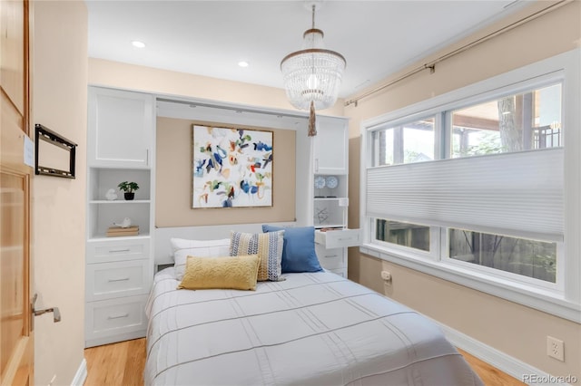 1824 Pearl St Unit B, Boulder, CO 80302 - bedroom featuring light wood-style flooring, a chandelier, and recessed lighting