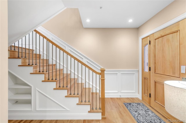 1824 Pearl St Unit B, Boulder, CO 80302 - entryway with wood finished floors, a decorative wall, stairs, and a wainscoted wall