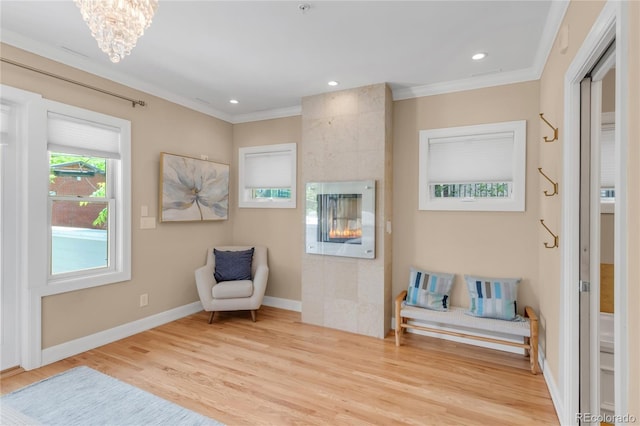1824 Pearl St Unit B, Boulder, CO 80302 - sitting room with ornamental molding, wood finished floors, a tile fireplace, a chandelier, and recessed lighting