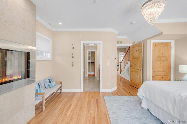 1824 Pearl St Unit B, Boulder, CO 80302 - bedroom with wood finished floors, crown molding, recessed lighting, and a chandelier