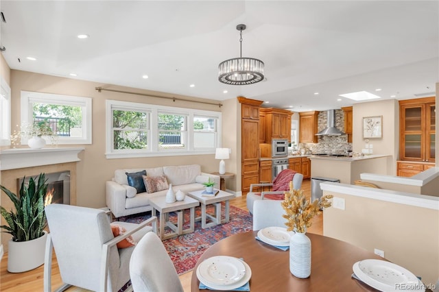 1824 Pearl St Unit B, Boulder, CO 80302 - dining room with recessed lighting, a chandelier, a high end fireplace, and light wood-style floors