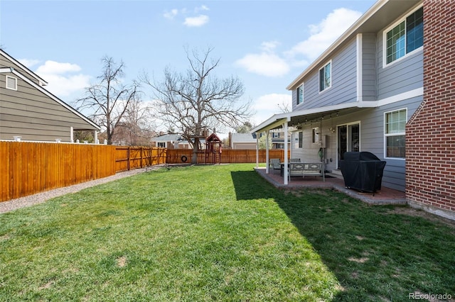 12945 E Colorado Ave, Aurora, CO 80012 - view of yard featuring a patio and a fenced backyard