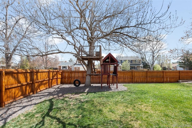 12945 E Colorado Ave, Aurora, CO 80012 - view of yard featuring a playground and a fenced backyard