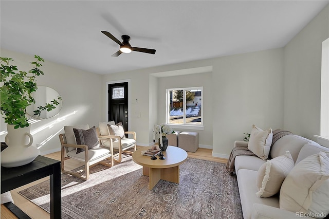 living room with hardwood / wood-style flooring and ceiling fan