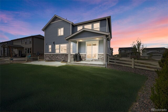 6802 S Uriah St, Aurora, CO 80016 - back of property featuring stone siding