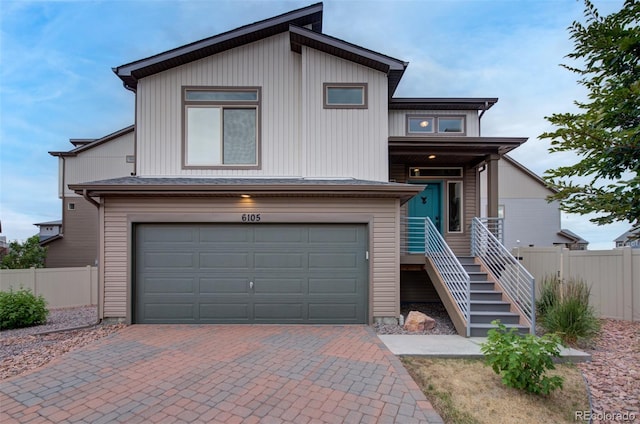 view of front of property with a garage