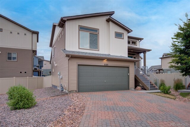 view of front of property featuring a garage