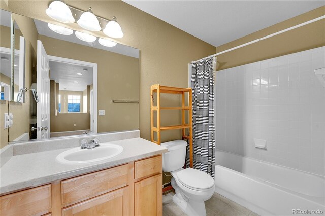 full bath featuring tile patterned floors, toilet, vanity, and shower / bath combination with curtain
