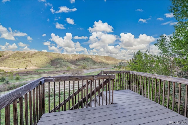 wooden terrace featuring a mountain view