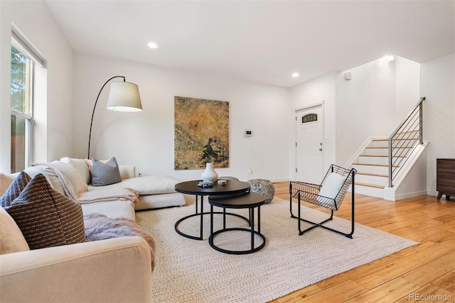 4190 W Alameda Ave, Denver, CO 80219 - living room featuring stairway, light wood-style floors, recessed lighting, and baseboards