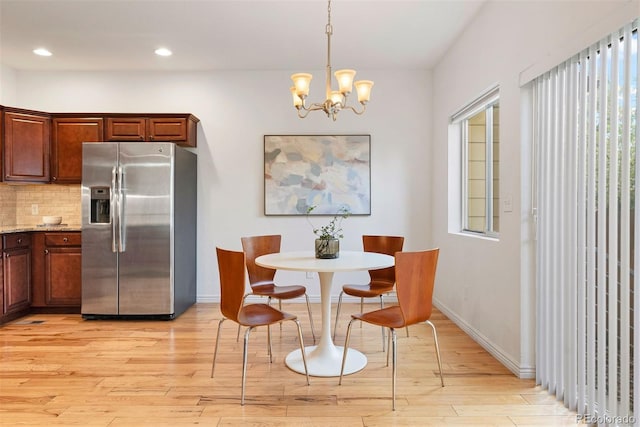 4190 W Alameda Ave, Denver, CO 80219 - dining space featuring light wood-style flooring, a chandelier, recessed lighting, and baseboards