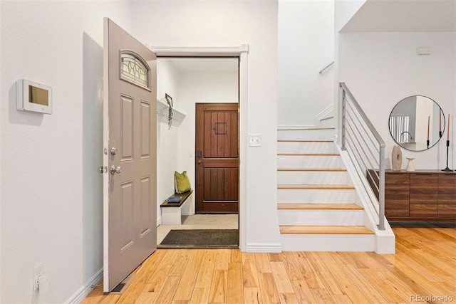 4190 W Alameda Ave, Denver, CO 80219 - entryway with wood finished floors and stairs