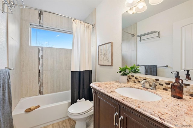 4190 W Alameda Ave, Denver, CO 80219 - bathroom with toilet, shower / bathtub combination with curtain, and vanity
