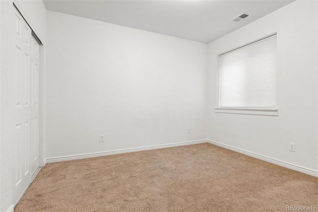 4190 W Alameda Ave, Denver, CO 80219 - unfurnished bedroom featuring carpet flooring, a closet, and baseboards