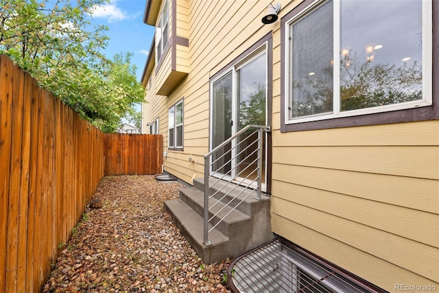 4190 W Alameda Ave, Denver, CO 80219 - view of side of property featuring fence and entry steps