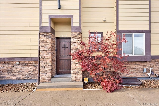 4190 W Alameda Ave, Denver, CO 80219 - view of exterior entry featuring stone siding