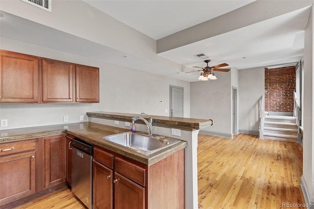 3211 Zuni St Unit 9, Denver, CO 80211 - kitchen featuring stainless steel dishwasher, a peninsula, light wood-style floors, brown cabinetry, and a ceiling fan