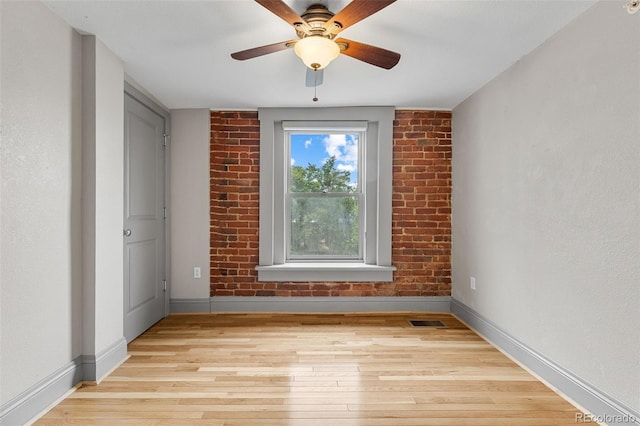 3211 Zuni St Unit 9, Denver, CO 80211 - spare room featuring light wood-style floors and a ceiling fan