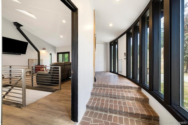5607 Crawford Gulch Rd, Golden, CO 80403 - hallway featuring wood finished floors, vaulted ceiling, and recessed lighting