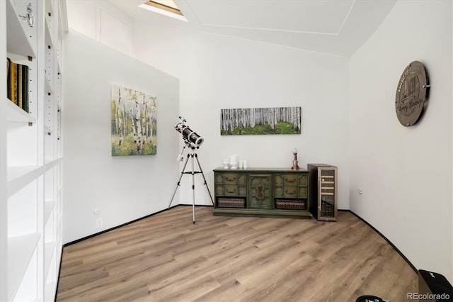 5607 Crawford Gulch Rd, Golden, CO 80403 - unfurnished living room featuring light wood finished floors and wine cooler