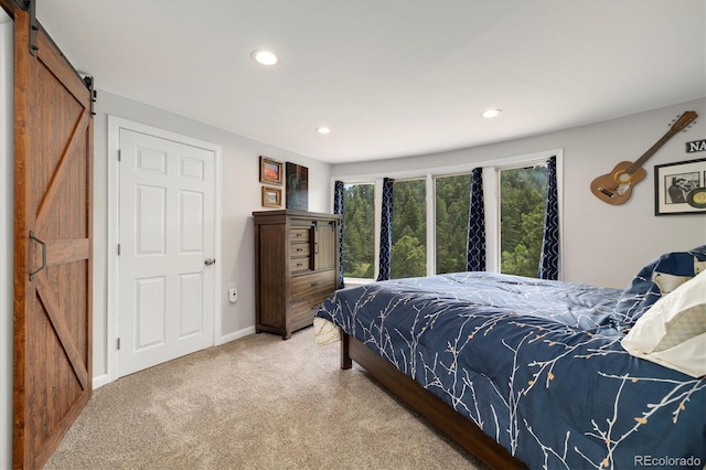 5607 Crawford Gulch Rd, Golden, CO 80403 - carpeted bedroom with a barn door and recessed lighting