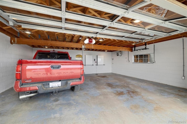5607 Crawford Gulch Rd, Golden, CO 80403 - garage with a garage door opener and concrete block wall