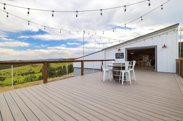 5607 Crawford Gulch Rd, Golden, CO 80403 - wooden terrace featuring outdoor dining space and a mountain view
