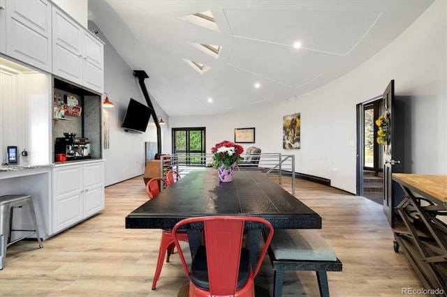 5607 Crawford Gulch Rd, Golden, CO 80403 - dining room with light wood finished floors, recessed lighting, a skylight, and high vaulted ceiling