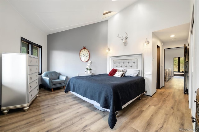5607 Crawford Gulch Rd, Golden, CO 80403 - bedroom with light wood-type flooring and vaulted ceiling