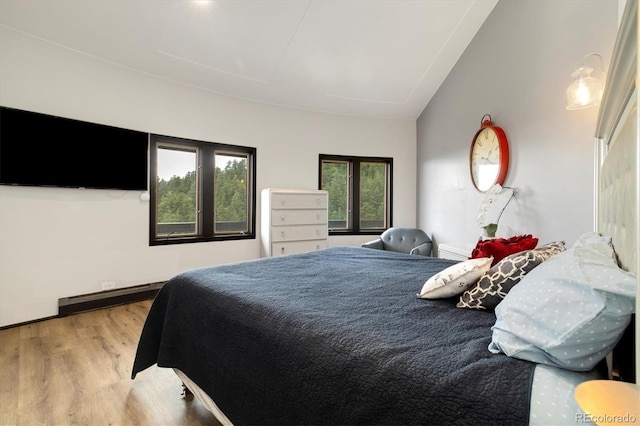 5607 Crawford Gulch Rd, Golden, CO 80403 - bedroom featuring wood finished floors and lofted ceiling