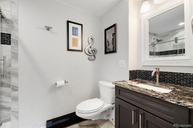 5607 Crawford Gulch Rd, Golden, CO 80403 - bathroom featuring vanity, backsplash, and a tile shower
