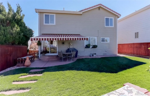 back of house with a patio