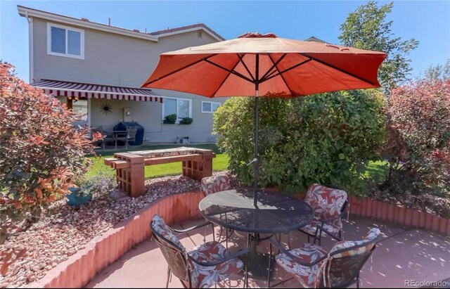 view of patio / terrace featuring outdoor dining space and area for grilling