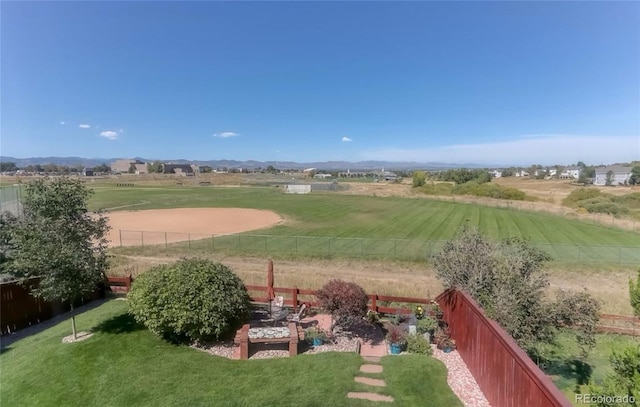 view of yard featuring a view of rural / pastoral area and a mountain view