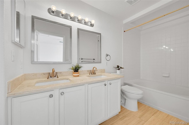 full bath featuring toilet, double vanity,  shower combination, and wood finished floors
