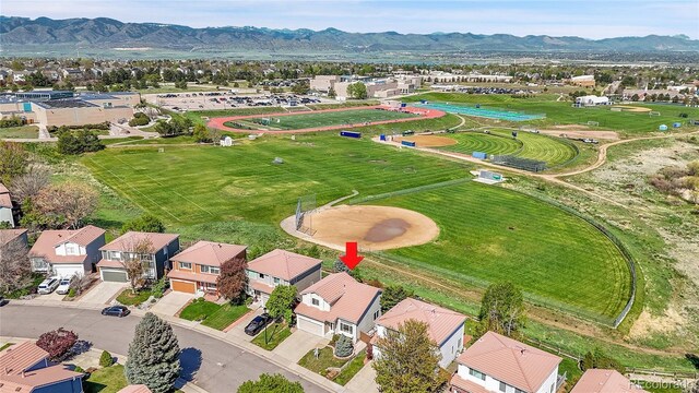 10057 Cedaridge Way, Highlands Ranch, CO 80129 - aerial perspective of suburban area featuring a mountain backdrop