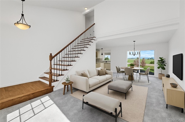 10057 Cedaridge Way, Highlands Ranch, CO 80129 - carpeted living area with stairs, a chandelier, and a towering ceiling