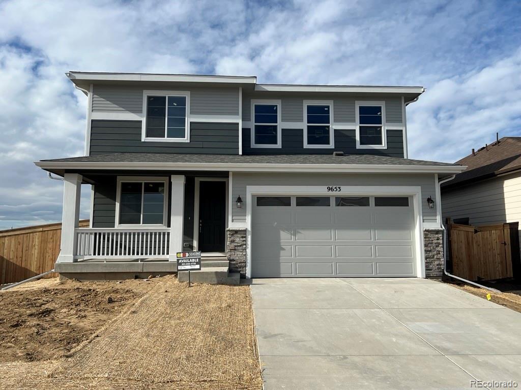 view of front of home with covered porch and a garage