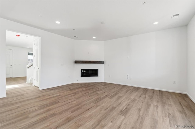 unfurnished living room with light wood-type flooring