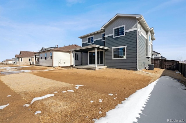 back of house featuring a patio area and central air condition unit