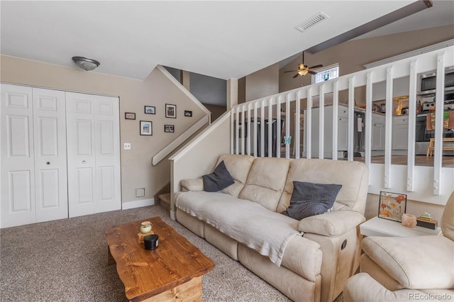 living room featuring carpet flooring and ceiling fan