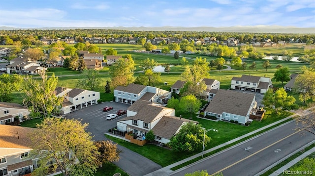aerial view of residential area with a water and mountain view