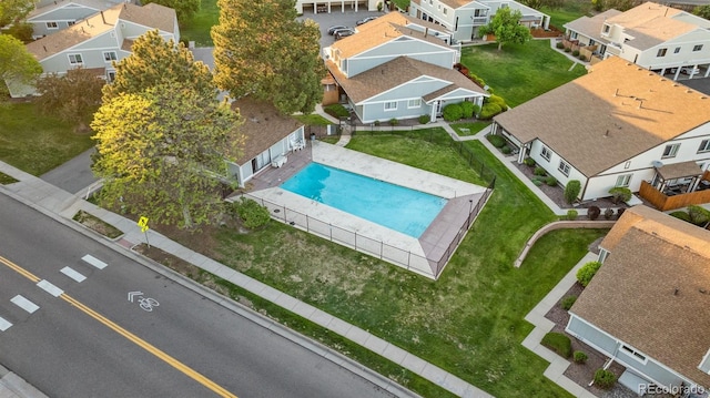 aerial perspective of suburban area featuring a pool