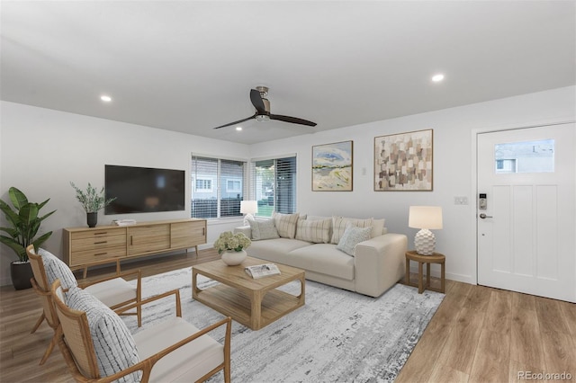 living room with wood finished floors, recessed lighting, a ceiling fan, and baseboards