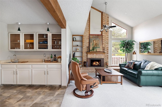 10572 E Orchard Pl, Englewood, CO 80111 - living area featuring a textured ceiling, a ceiling fan, and a brick fireplace