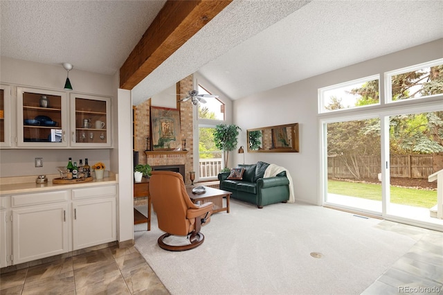 10572 E Orchard Pl, Englewood, CO 80111 - living area featuring a ceiling fan, a textured ceiling, a brick fireplace, and lofted ceiling
